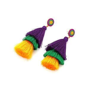 Detail of three-tier tassel earrings in purple, green, and yellow with beaded flower stud