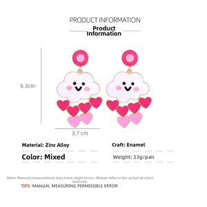 Detail view of cloud earrings with pink heart charms showing size 6.3cm x 3.7cm