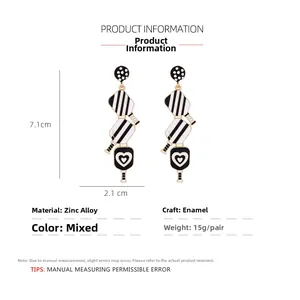 Detailed view of long enamel racket earrings with heart patterns and dimensions