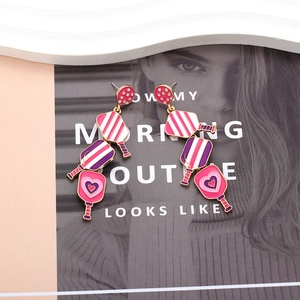 Close-up of heart-patterned pickleball paddle earrings with colorful enamel layers