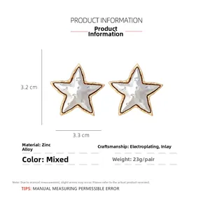 Detailed view of retro star and moon earrings with dimensions 3.3cm by 3.2cm and 23g weight