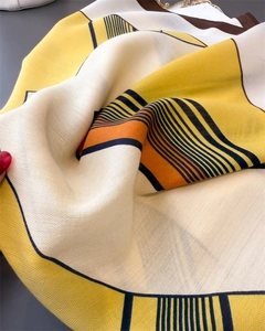 Macro detail of geometric herringbone texture and contrasting colors on a soft neck scarf