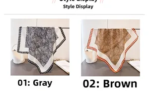 Detail display of grey and brown palm leaf pattern square scarves on a hanging rod