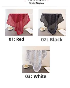 Detail display of paisley and polka dot printed silk scarves in red black and white