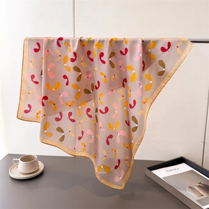 Elegant paisley printed faux silk square scarf in dusty pink with golden trim borders