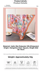 Detail view of the silk-like lemon print scarf with soft satin texture and vibrant colors
