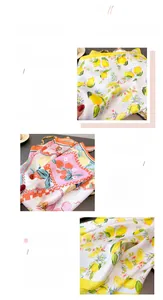 Detail of premium silk-like scarf featuring lemon prints and fine stitching edges