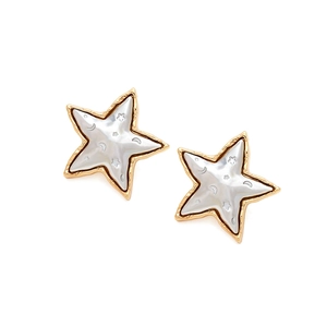 Macro shot of gold star earrings with mother of pearl inlay and moon star engraving