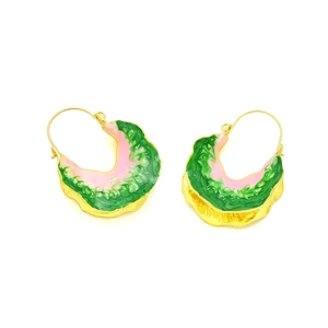Detail of wave-shaped enamel earrings with green and pink marble texture and gold trim