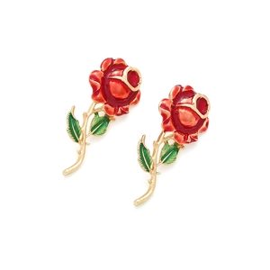 Detail of red enamel rose earrings with green leaves and gold stems on white background