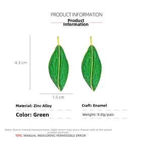 Détails de boucles d'oreilles feuilles en émail vert avec dimensions et spécifications