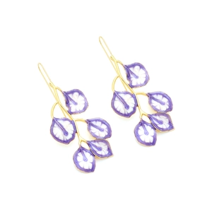 Detailed view of long leaf earrings with gold branches and purple enamel petals