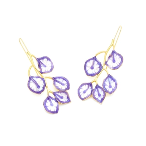 Detailed view of long leaf earrings with gold branches and purple enamel petals