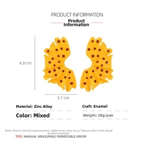 Detail of yellow enamel leaf earrings with red polka dots and dimensions 6x3.7cm