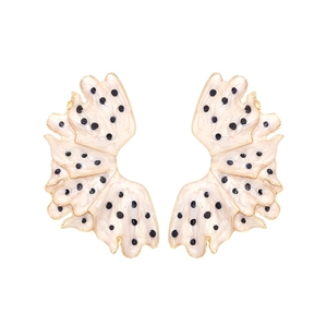 Enamel drop oil leaf earrings with black polka dots and gold edges on white background