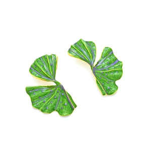 Exaggerated enamel leaf earrings with green and purple patterns and golden edges