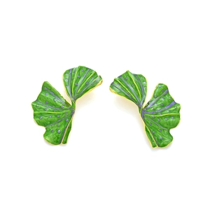 Macro detail of ginkgo leaf earrings with green enamel and purple dotted texture
