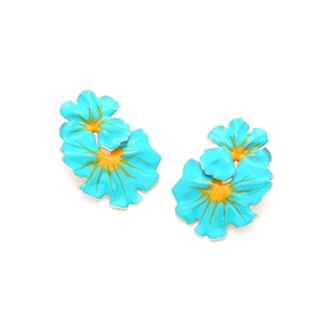 Detail of blue and yellow enamel flower earrings with intricate gold plated metal edges