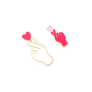 Asymmetric heart gesture enamel earrings in pink and gold finish for women