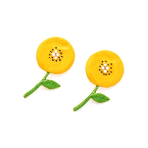 Detailed macro view of yellow enamel sunflower earrings with small white pearls