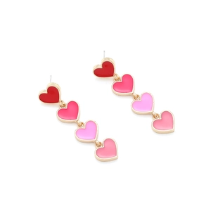 Pink gradient enamel heart drop earrings in gold finish with a tiered long dangling design