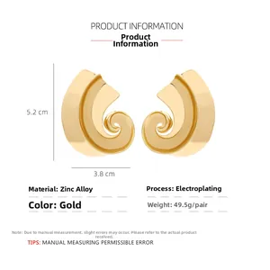 Macro detail of gold spiral C-shaped earrings showing dimensions 5.2cm x 3.8cm