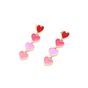 Close-up of long gradient pink enamel heart drop earrings with tiered dangle design