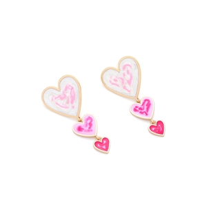 Detail of three-tier heart drop earrings with gold edges and pink marble enamel finish