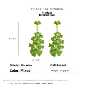Detailed view of enamel ginkgo leaf earrings with dimensions 6.4x2.7cm and zinc alloy specs