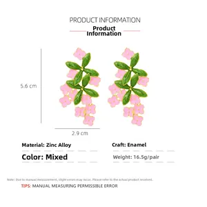 Detail view of floral enamel earrings with dimensions 5.6cm by 2.9cm and zinc alloy specs