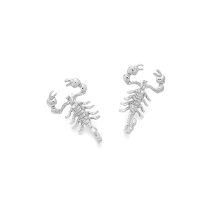 Close-up of silver metal scorpion earrings with detailed gothic animal design