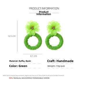 Detail showing dimensions of green handmade raffia and resin flower earrings