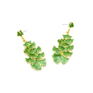 Macro detail of layered green enamel ginkgo leaf earrings with gold-plated edges