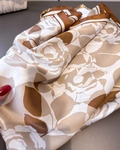 Detail of elegant rose floral silk-feel scarf showing soft texture and glossy finish