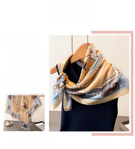 Detail view of silk scarf with vintage carriage print and contrast border trim