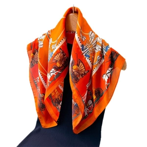 Elegant orange silk square scarf featuring classic European horse carriage print design
