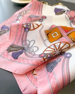 Detail of silk-like satin square scarf with vintage rope prints and delicate rolled edges
