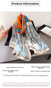 Detailansicht des 180x85cm Paisley-Seidenschals mit orangefarbenem und blauem Blumenmuster
