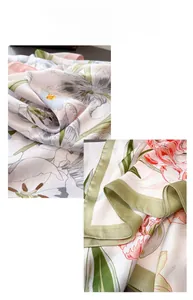 Close-up of floral satin scarf showing soft texture and elegant tulip pattern printing