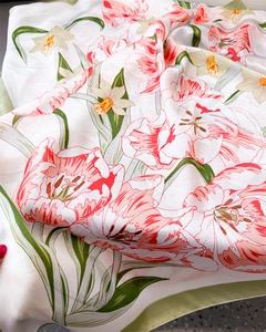 Detail of silk scarf showing soft satin luster and tulip floral print with green edges