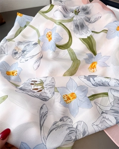 Detail of floral silk scarf showing sheer texture and delicate flower pattern