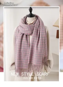 Close-up of pink and grey houndstooth faux cashmere scarf with fringe details