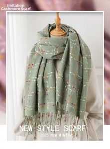 Close-up of green plaid cashmere-like scarf texture with elegant fringed edges