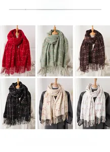Detail showing soft cashmere-like fringed scarves in six solid colors with speckled texture
