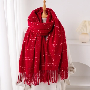 Red plaid tassel shawl scarf in cashmere-like texture displayed on a mannequin