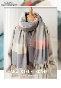 Detail of soft cashmere-like fabric scarf with pink plaid pattern and fringe