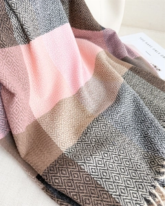 Close-up of color-block plaid scarf with cashmere texture and fringe tassels