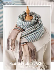 Detailed texture of imitation cashmere scarf with teal brown stripes and soft fringes