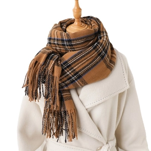 Vintage brown plaid scarf with tassels styled over a cream cashmere coat for winter