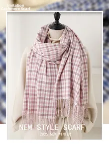 Detail of pink plaid imitation cashmere scarf with soft fringes on a beige coat model